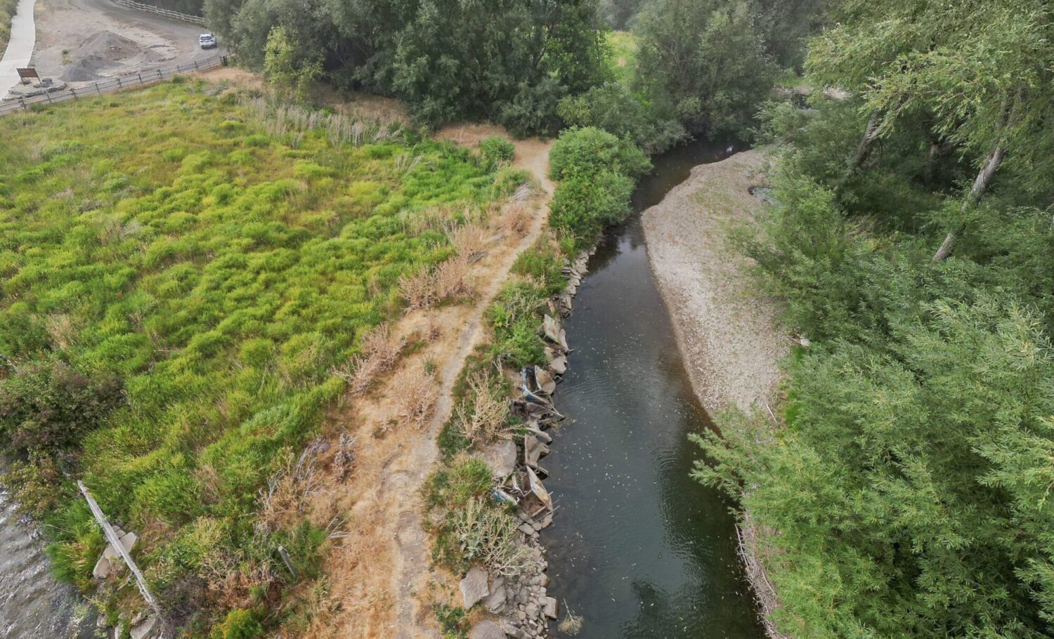 Dozens of old cars lined the banks of the Logan River, near Trapper Park. (Photo Courtesy: Juniper Earthworks)